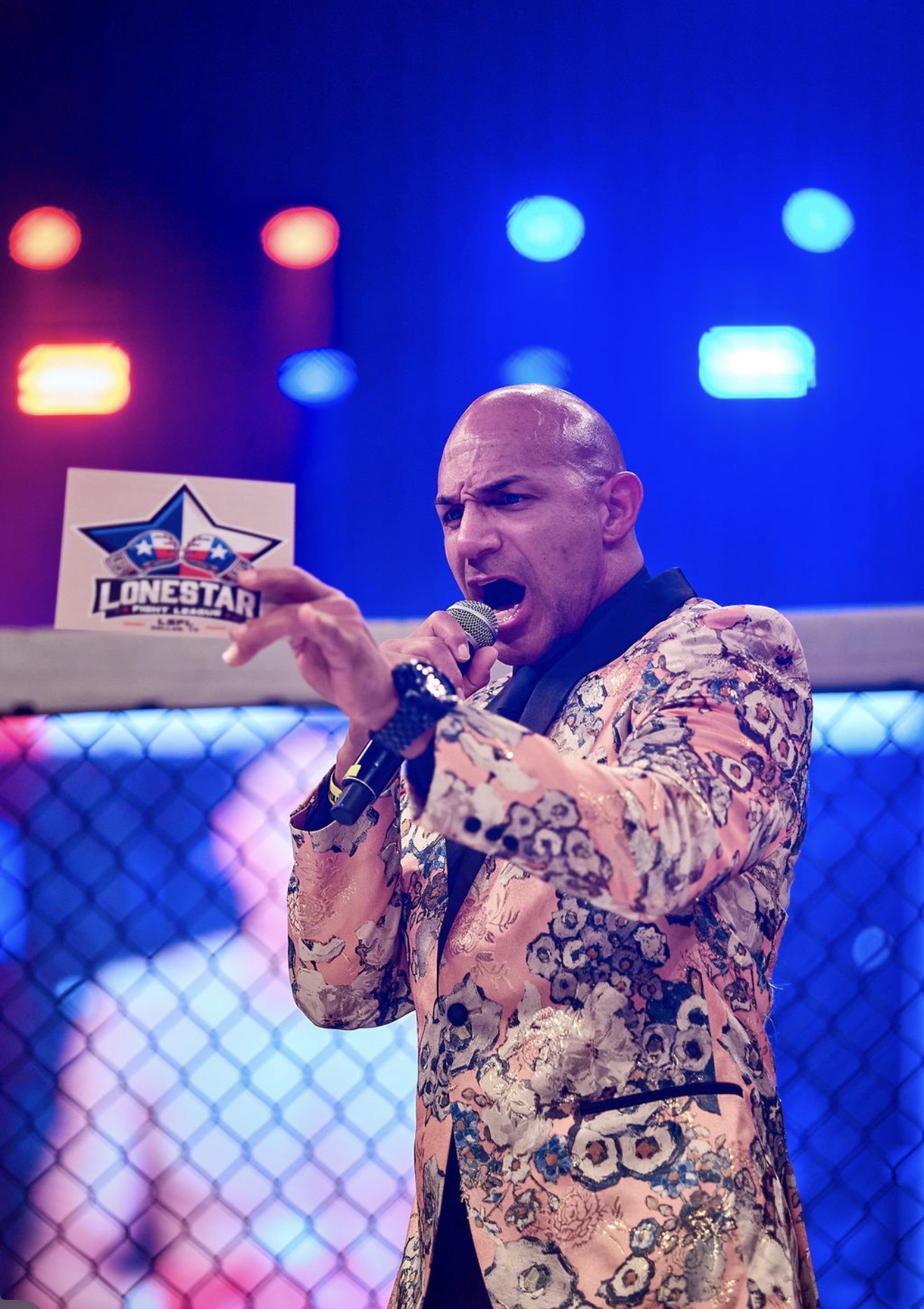 LSFL announcer inside the cage with crowd